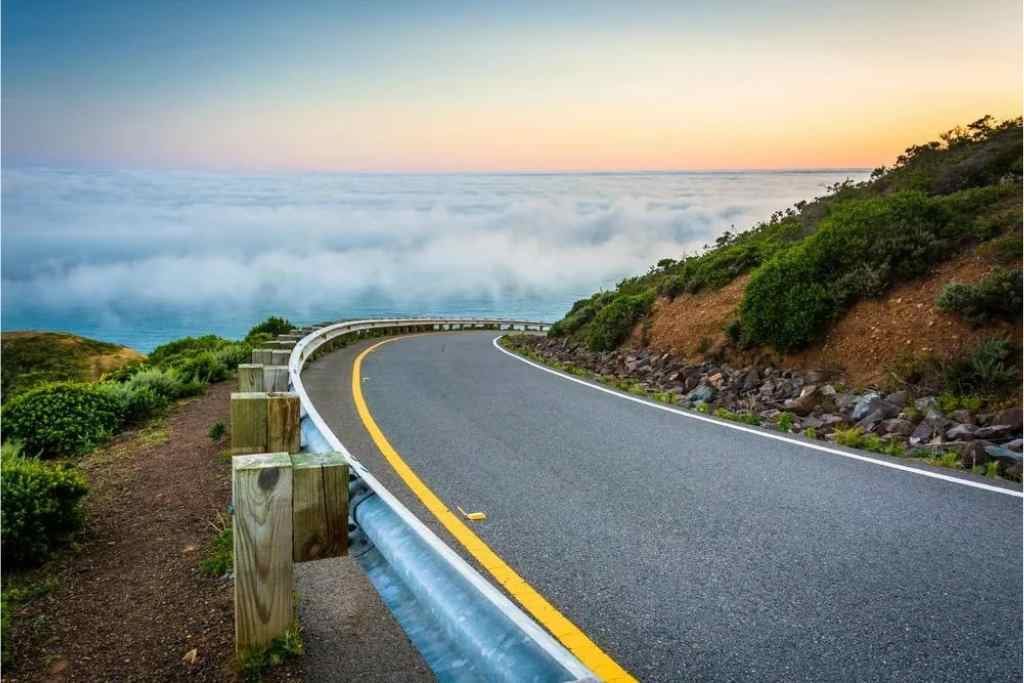 Road and view of fog over the San Francisco Bay, Golden Gate National Recreation Area, in San Francisco, California