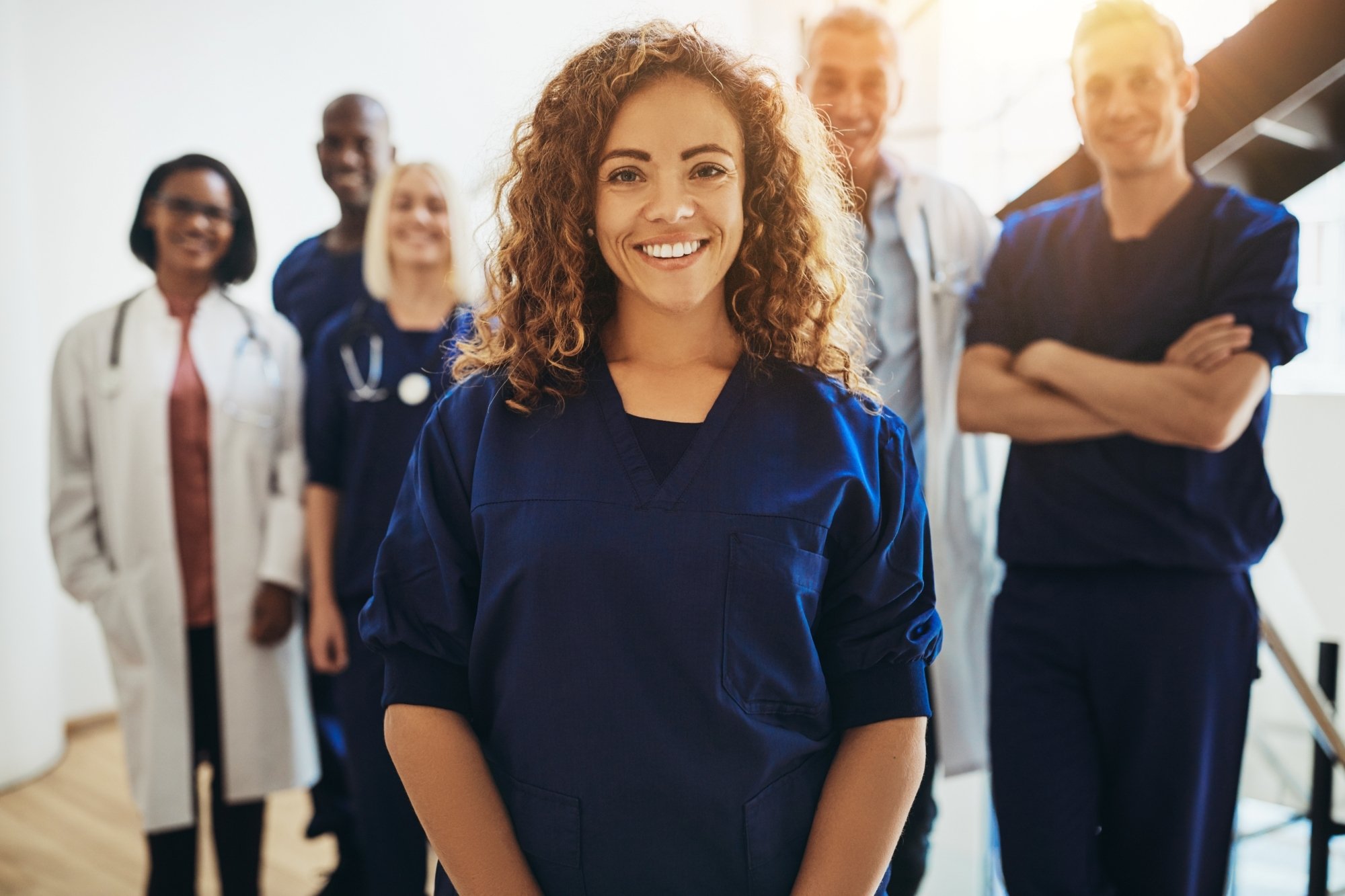 Diverse Hart healthcare team supported by unified population health data by Hart.