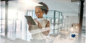 Woman working in office and smiling