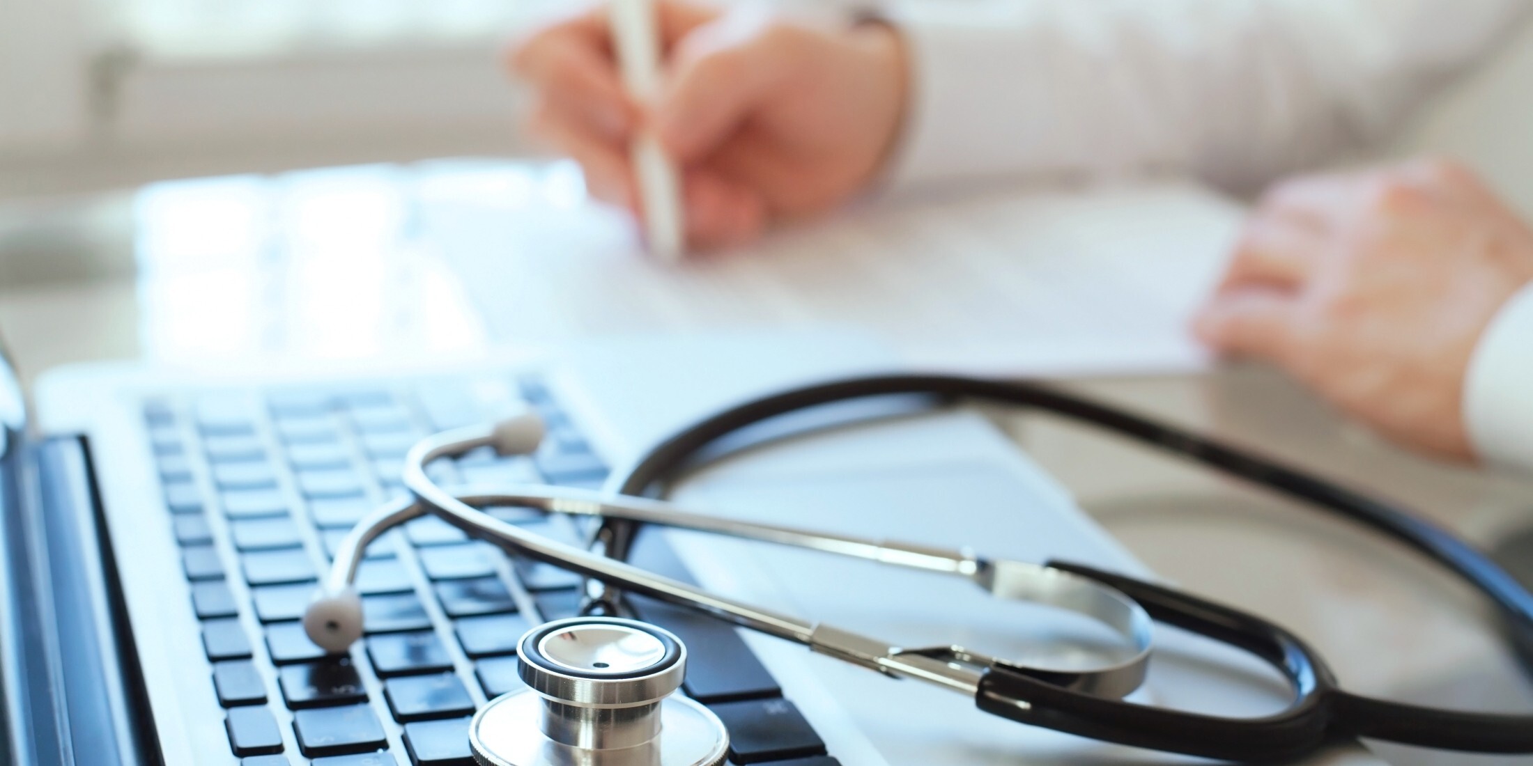 Healthcare professional reviewing Hart’s population health software.